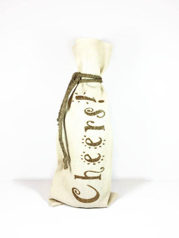 Canvas wine bag with Cheers written in gold glitter vinyl, comes with jute rope tie