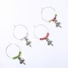 set of 4 candy cane wine glass charms surrounded red, green and silver beads