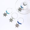 set of 4 snowflake wine charms surrounded by glass beads