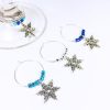 set of 4 snowflake wine charms surrounded by blue and silver glass beads