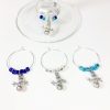 set of 4 snowman wine charms surrounded by cobalt blue, light blue and silver glass beads
