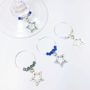 dallas cowboys unique gifts include set of 4 wine charms surrounded by cowboys team colors