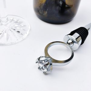 silver large ring on silver wine bottle stopper