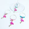 gold wine charms with pink flamingos