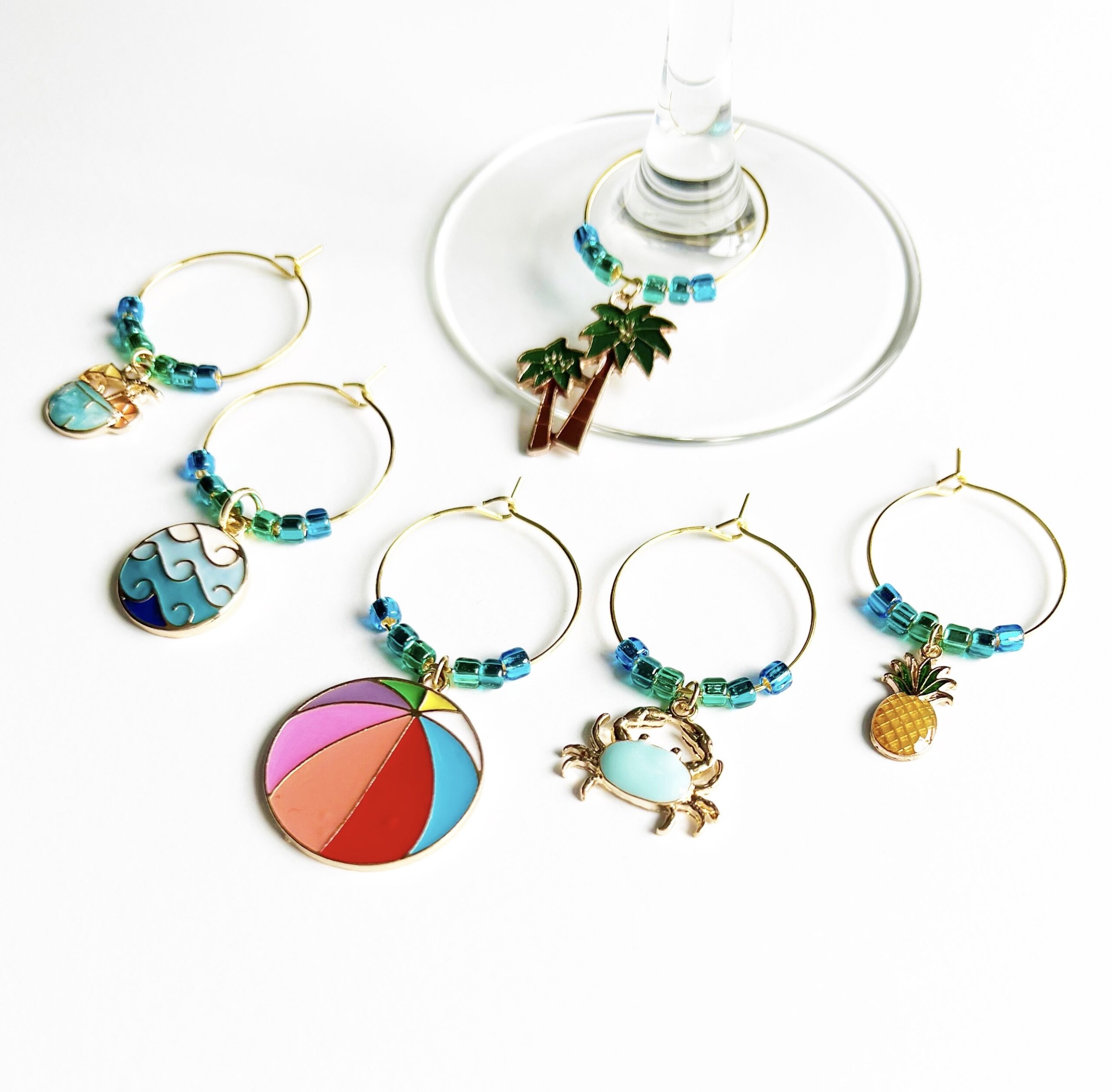 gold tropical wine charm set